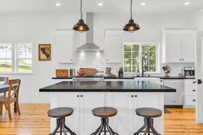 Chefs Kitchen with large island and extra seating 