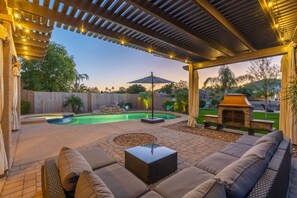 Outdoor lounge area with wood fire pit