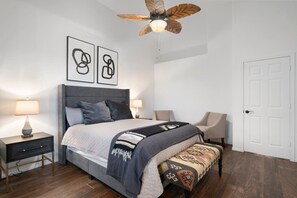 Master bedroom featuring a Queen size bed, an extension with a bunk bed, and an ensuite bathroom