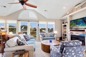 Relax in the spacious Living Area with a large, flat-screen TV.