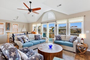 Relax in the spacious Living Area with a large, flat-screen TV.