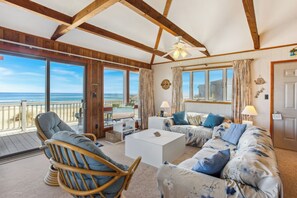 Relax in the beautiful Living Area with plenty of cozy furniture, unbeatable views of the ocean, and a flat screen tv!