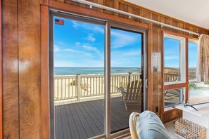 Relax in the beautiful Living Area with plenty of cozy furniture, unbeatable views of the ocean, and a flat screen tv!