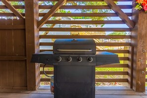 Step outside to enjoy an under-house Outdoor Dining Area complete with a Gas Grill—perfect for barbecues after a day at the beach.