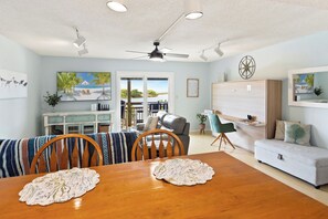 The open-concept design boasts bamboo flooring and a Kitchen with a breakfast bar where you can enjoy delicious meals together indoors.