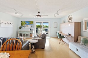 The open-concept design boasts bamboo flooring and a Kitchen with a breakfast bar where you can enjoy delicious meals together indoors.