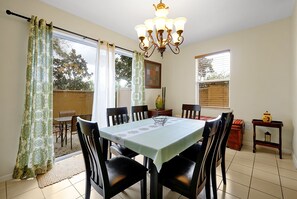 Gather around and create unforgettable moments in this beautifully designed open dining room!