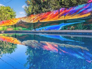 New Wall mural that shows the sunsetting over the mountains with a golf course.