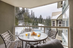 Private balcony overlooking the pool area and Blackcomb Mountain slopes