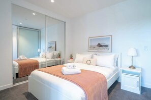 comfortable queen sized bed with large wardrobe