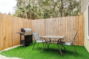 A beautiful patio with grill