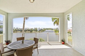 Seaside Sanctuary: Find peace on our patio overlooking the sparkling water.
