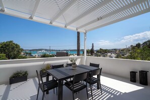 Outdoor dining made effortless on the private balcony.