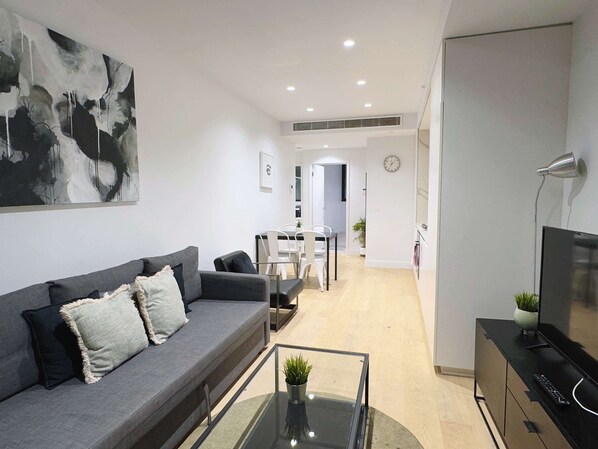 The living area with a 3-seater sofa bed that folds out to a double.
