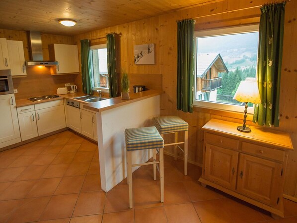 Furniture, Interior Design, Wood, Flooring, Kitchen, Cabinetry, Ceiling, Floor, Chair, Room