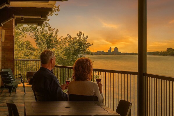 Experience spectacular golden hour views from your spacious outdoor retreat. Sip your favorite drink as the sky transforms over the serene river, an unforgettable end to every day.