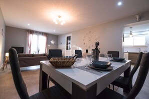 Lounge/dining room with 1 sofa - 1 coffee table - Furniture + smart TV - 6-person dining table - 2 separate WCs. 