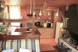 Kitchen with hob - Tassimo coffee maker + filter - Electric kettle - Dishwasher - Household linen - Oven - Microwave - Toaster - Fridge + Freezer.