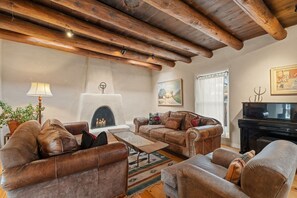 Come on in! Gorgeous beamed ceilings and plush seating for your enjoyment