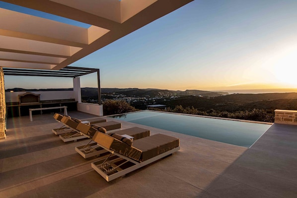 Lounge by the pool and feel the warmth of the sun on your skin.