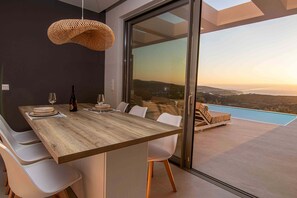 Dining area of the accommodation, with firect access to the swimming pool