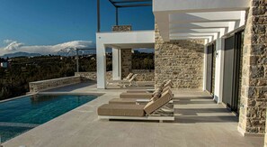 Let the morning sun warm your skin as you sip coffee by the pool