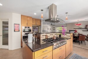 Kitchen with Island and Stainless Steel Appliances