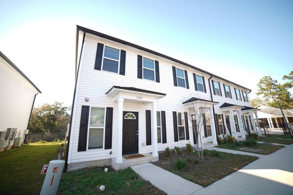 Beautiful new construction end unit with the pool and clubhouse to the right of this building. 