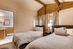 Bright and airy retreat with vaulted ceilings and soft natural light, perfect for restful mornings.