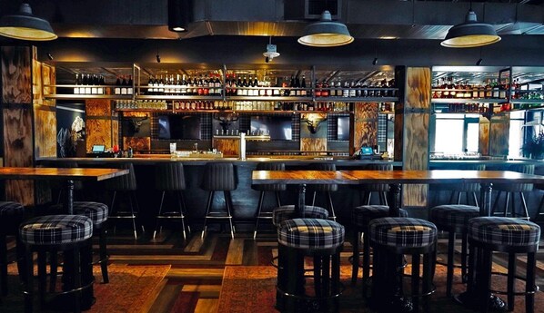 Cozy and rustic dining experience with a lively atmosphere, handcrafted cocktails, and delicious bites to savor.