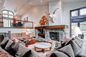 Take a seat in front of the fireplace and enjoy a movie in the spacious living area.