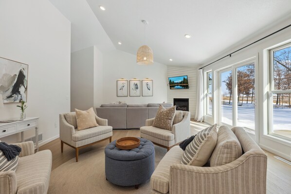 Bright and inviting living space with multiple seating options