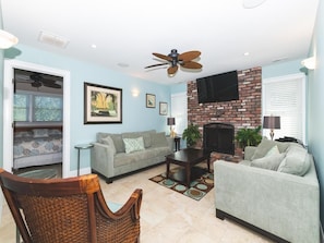 Cozy living room with a fireplace and comfortable seating.