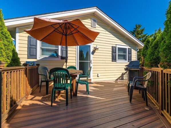 Tranquil screened-in porch, perfect for coffee or reading.