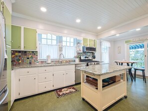 Functional kitchen with a central island and storage.