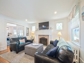 Inviting living room with a plush seating area and fireplace.