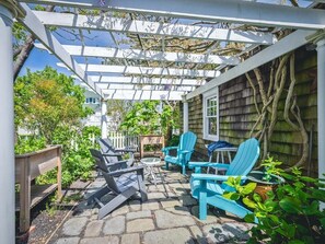 Serene garden seating under a pergola.