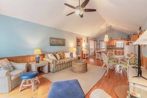 Open Living & Dining – Stylish coastal vibe with natural light and comfy wicker furniture.