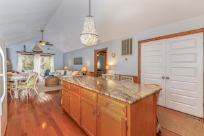 Stylish kitchen & dining. Features a spacious island that seats up to 5, perfect for casual meals.