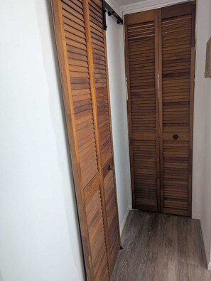 hallway from kitchen into bathroom, office and bedroom