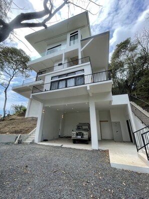 Two car garage downstairs and two outdoor showers. Automatic gate into driveway.