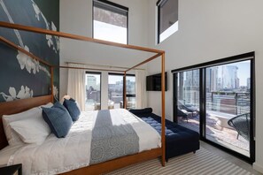 Primary bedroom: One king sized tempur-pedic bed and one twin sized day bed. Private balcony access!