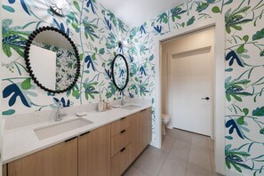 Primary bathroom: Dual vanity with a walk-in closet. Washer & Dryer located in the closet!