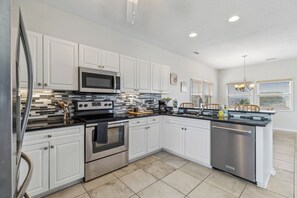 Well Stocked Kitchen with Stainless Appliances