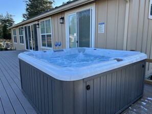 The hot tub is available year round and fully sanitized before your stay. You can access the tub through the living room sliders or the sliders in the primary bedroom.
