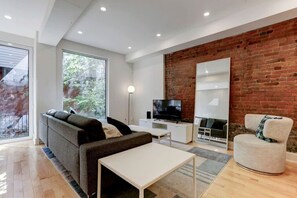 Enjoy the open layout, complete with a cozy sofa and a Smart HD TV for your favorite shows