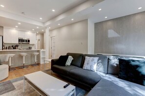 Revel in the open-concept design, where sleek kitchen elements flow effortlessly into the living space