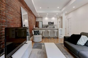 Another view reveals a seamless flow from living space to kitchen, perfect for relaxed gatherings