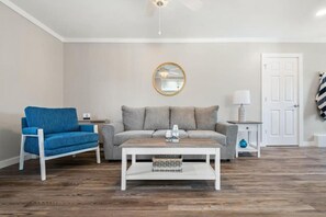 Nice, new bright remodeled living room with new floors, furniture and more