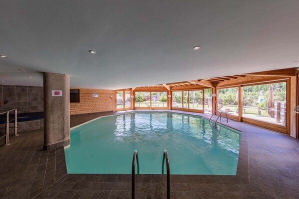 The inviting indoor heated pool, offering relaxation all year round, even during the warmer months.